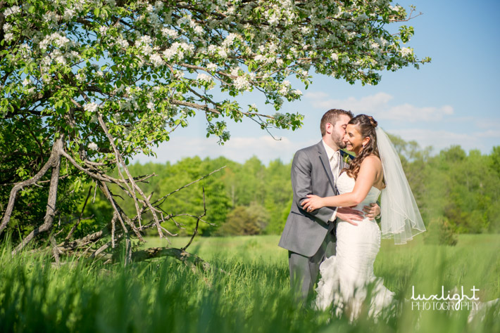 outdoor summer wedding photo with bride and groom