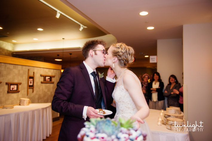 bride and groom kissing during their reception