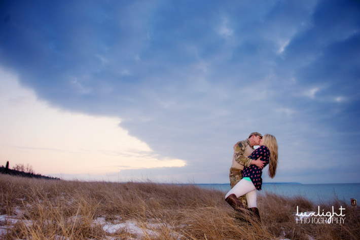 romantic kiss at the beach during engagement photos