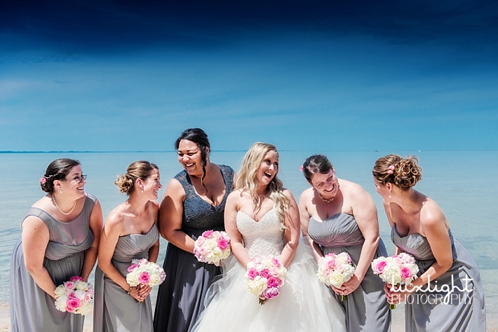 bride and bridesmaids at beach