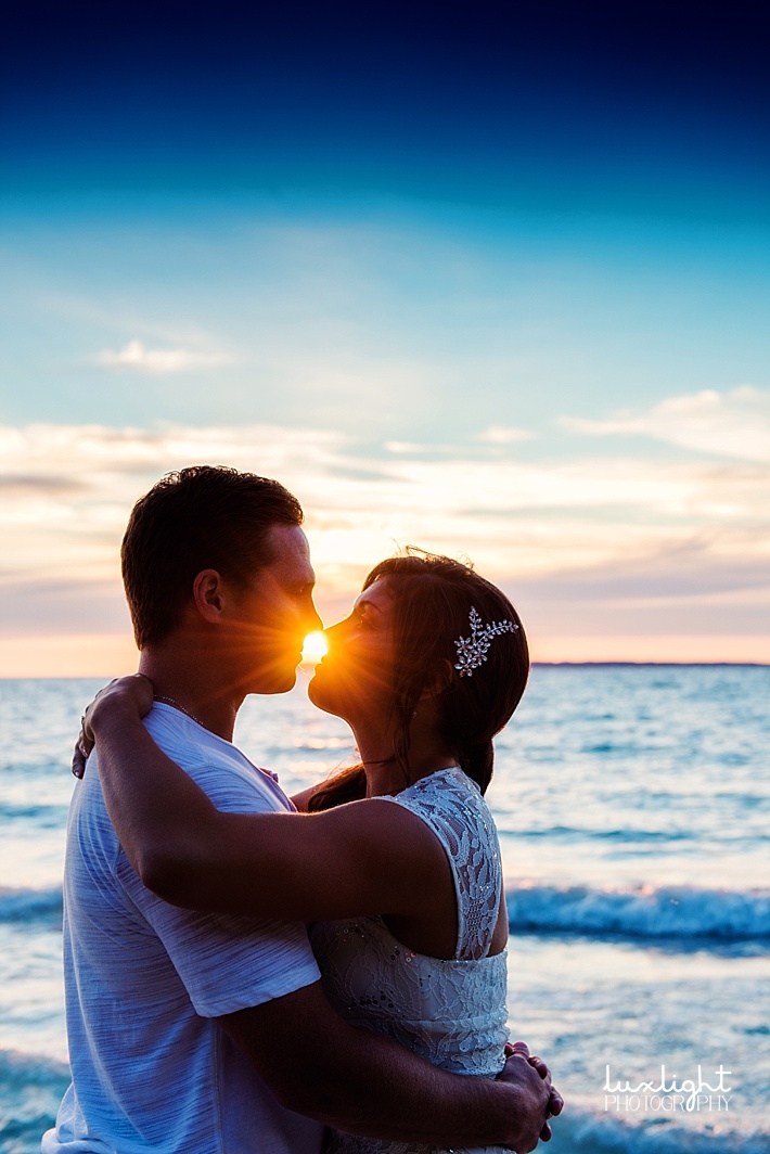 married couple at sunset 