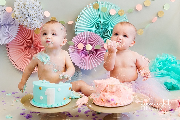 pink and teal one year old cake smash photography