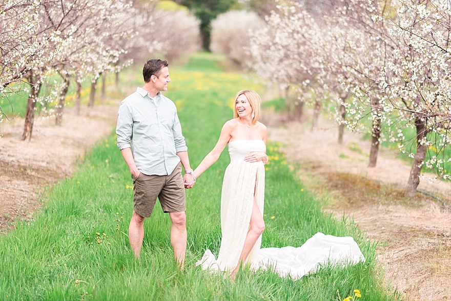 summer maternity photography in the cherry blossom orchards of northern michigan