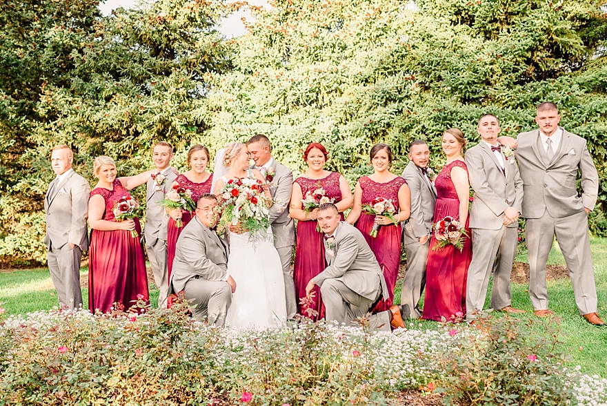 wedding photographers for fall maroon and gold wedding in northern michigan