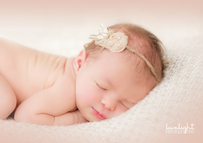curly pose for newborn photography session