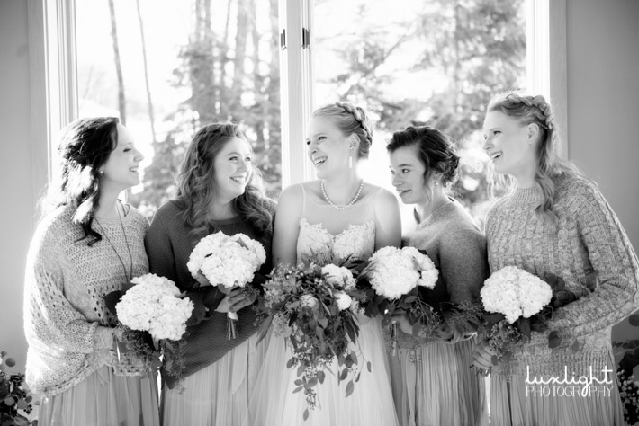 bride and bridesmaids during her winter wedding