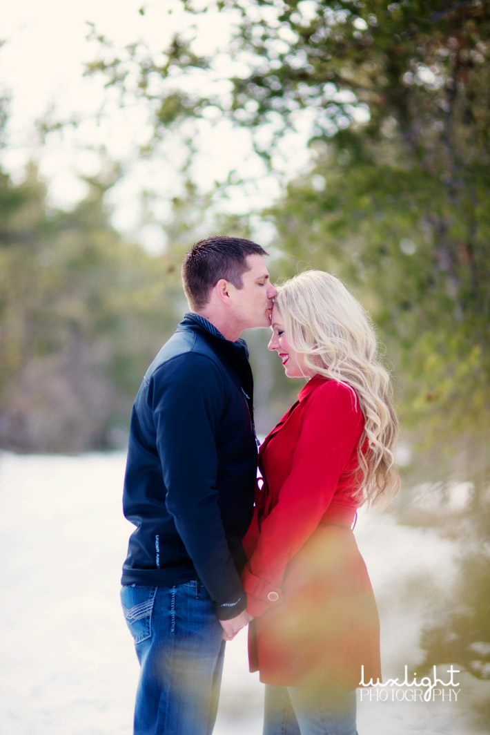 romantic kiss for engagement photo