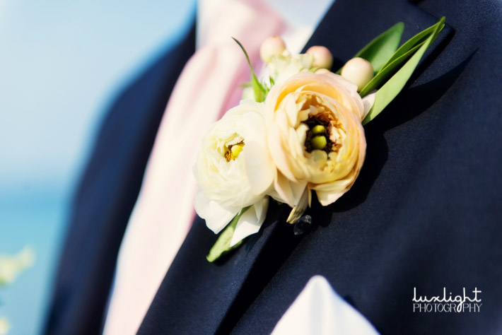 Grooms peach boutonniere
