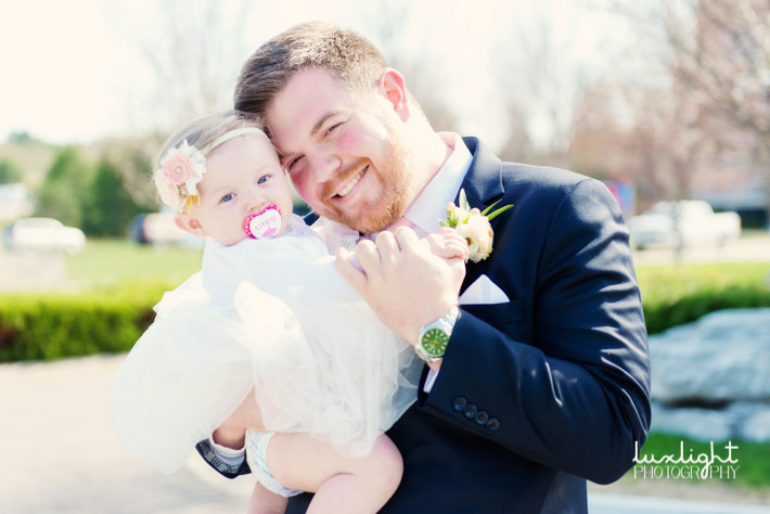 Cute photo of groom with his flower girl 