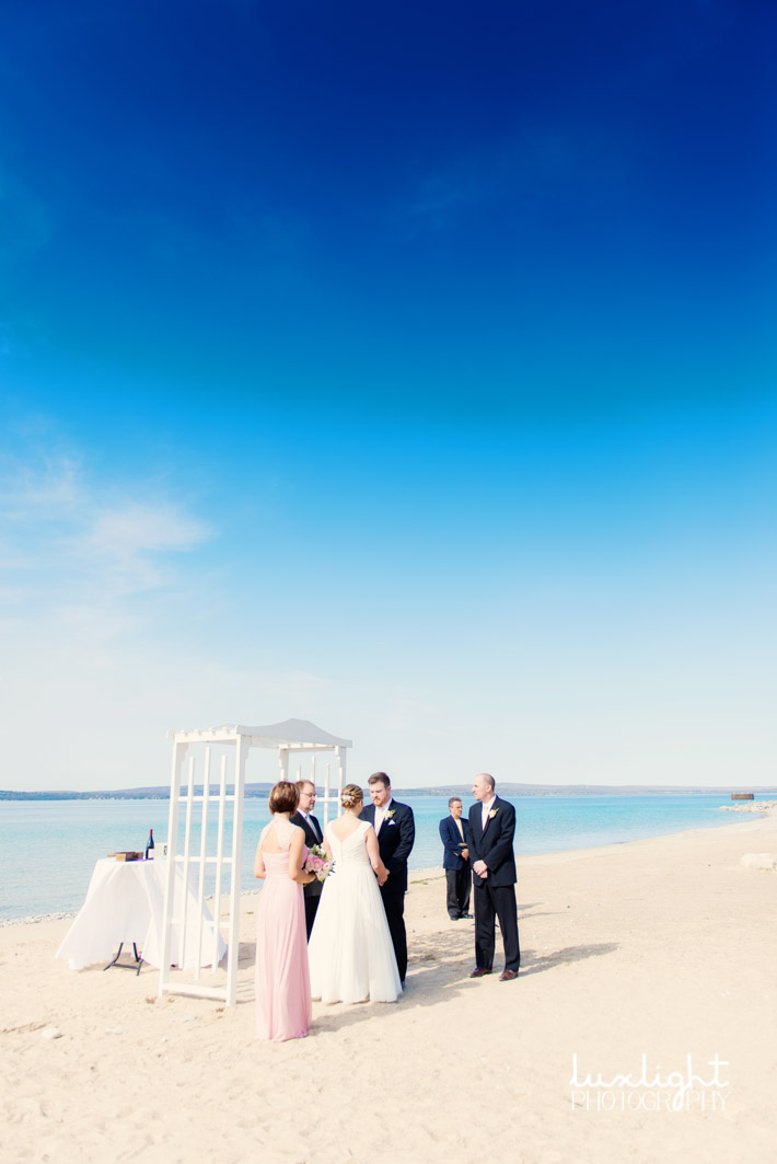 Bride and groom share vows on beautiful beach 