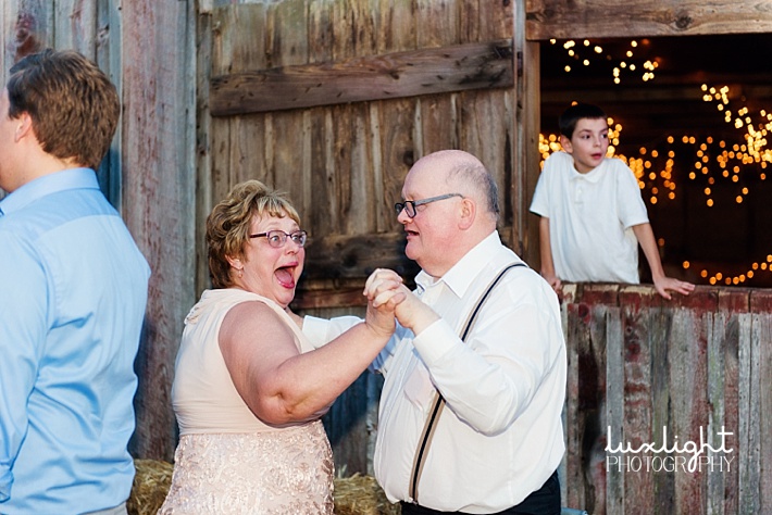 guests dancing at barn wedding