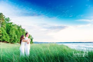 married couple overlooking lake michigan
