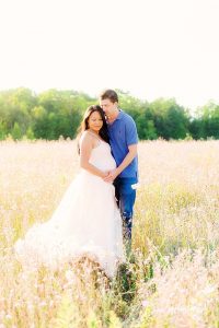couples maternity in field