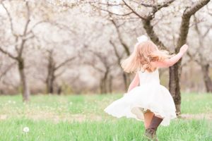 summer family portraits in northern michigan during the cherry blossoms